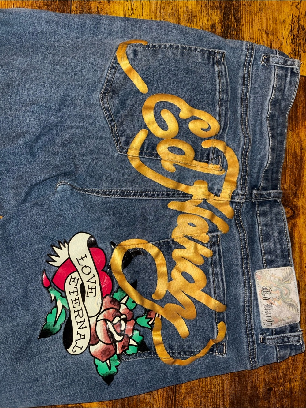 Ed Hardy women’s Blue Denim Jeans with Gold Script and Tattoo Graphic